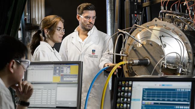 Dr Alfonso Chinnici and PhD students Elham Alipour and Shen Long working on a patented solar hybrid receiver, one of the approaches that can be used to provide heat for the solar gasification process. Picture: Tom Roschi Photography