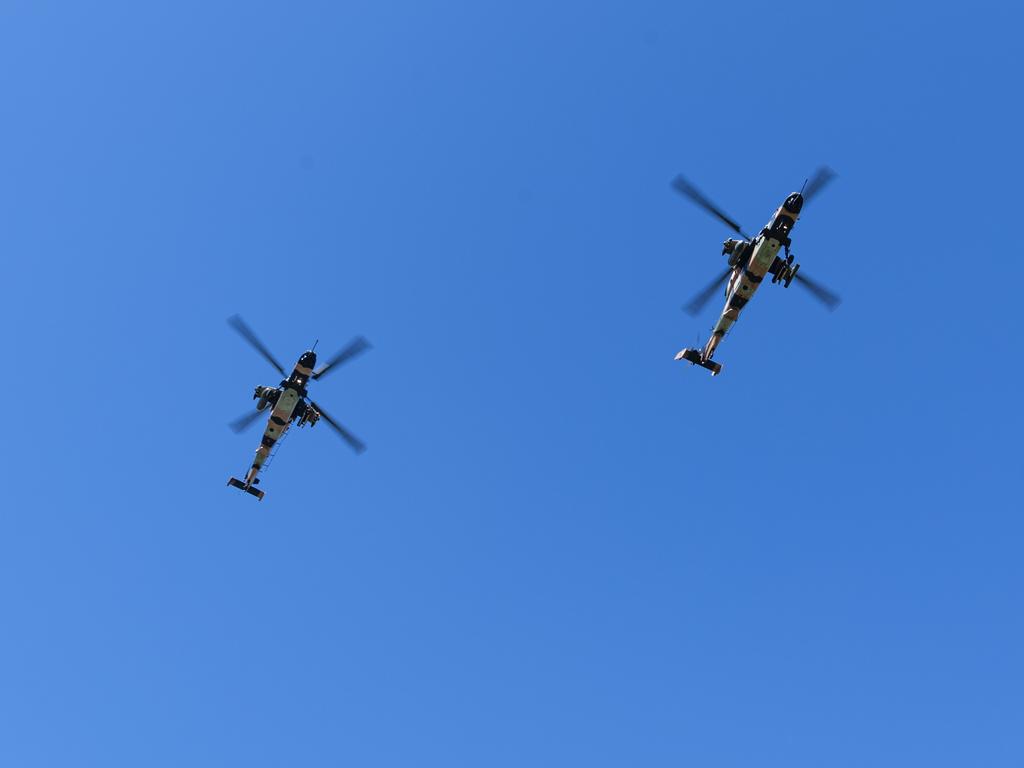 Two ARH Tiger helicopters part of a fly-past of Toowoomba's Anzac Day mid-morning service at the Mothers' Memorial, Thursday, April 25, 2024. Picture: Kevin Farmer