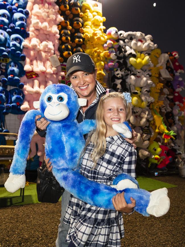 Annabelle Flynn and mum Jessica Flynn with a big soft monkey Annabelle won in sideshow alley at the Toowoomba Royal Show, Thursday, March 30, 2023. Picture: Kevin Farmer