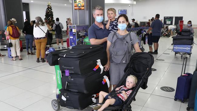 Nick Veitch and Kate Speechley with their sons Tom and Will at Melbourne Airport. Picture: David Crosling