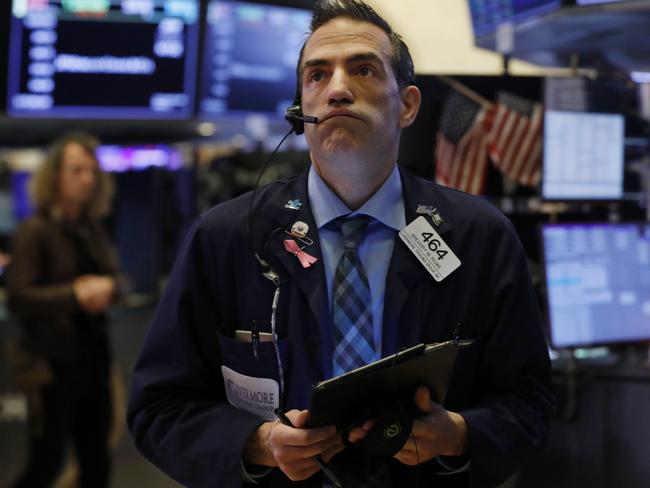 Trader Gregory Rowe on the floor of the New York Stock Exchange as markets fluctuated again. Picture: AP