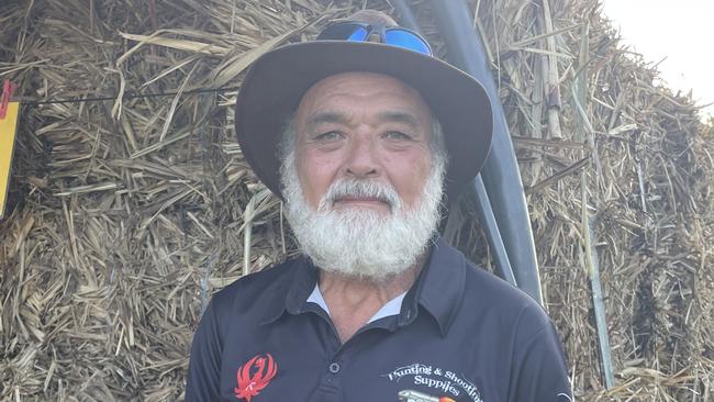 Les Mitchell at the Airlie Markets with his well-known truck and mulch, selling for $7 per bale.