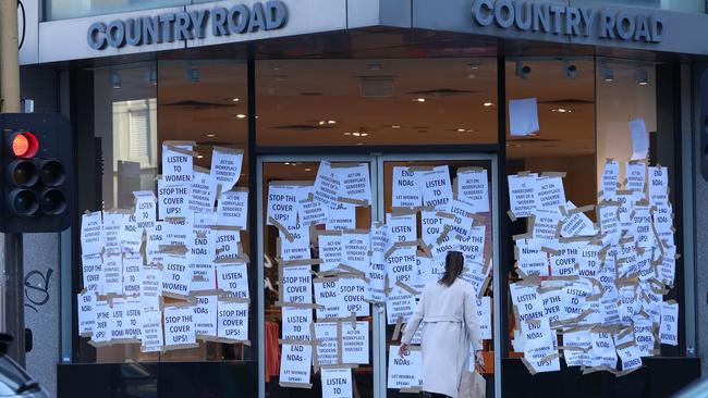 Country Road’s flagship Melbourne store was plastered with protest posters after allegations of sexual abuse within the company. Picture: David Caird