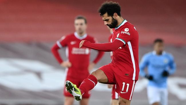 LIVERPOOL, ENGLAND - FEBRUARY 07: Mohamed Salah of Liverpool looks dejected after Manchester City's third goal scored by Raheem Sterling (Not pictured) during the Premier League match between Liverpool and Manchester City at Anfield on February 07, 2021 in Liverpool, England. Sporting stadiums around the UK remain under strict restrictions due to the Coronavirus Pandemic as Government social distancing laws prohibit fans inside venues resulting in games being played behind closed doors. (Photo by Laurence Griffiths/Getty Images)