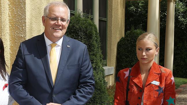 Grace Tame appears visibly uncomfortable as she stands for a picture with Scott Morrison. Picture: Gary Ramage/NCA NewsWire.