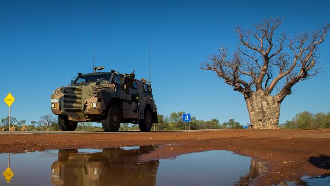 An Australian Army Bushmaster protected mobility vehicle drives along the Great Northern Highway during Exercise Northern Shield 2016. Bushmasters have been treated with a special coating from Gold Coast company Rhino Linings. Photo: Department of Defence