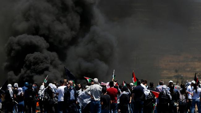 Palestinian protesters clash with Israeli security forces near the Jewish settlement of Beit El, near Ramallah in the occupied West Bank. Picture: AFP