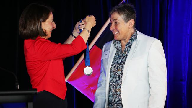 NSW Premier Gladys Berejiklian presents Jacki Largo with an award. Picture: Toby Zerna