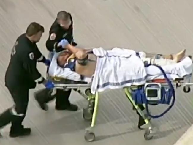 Tony Mokbel being attended to by medical staff after being stabbed at Barwon Prison.