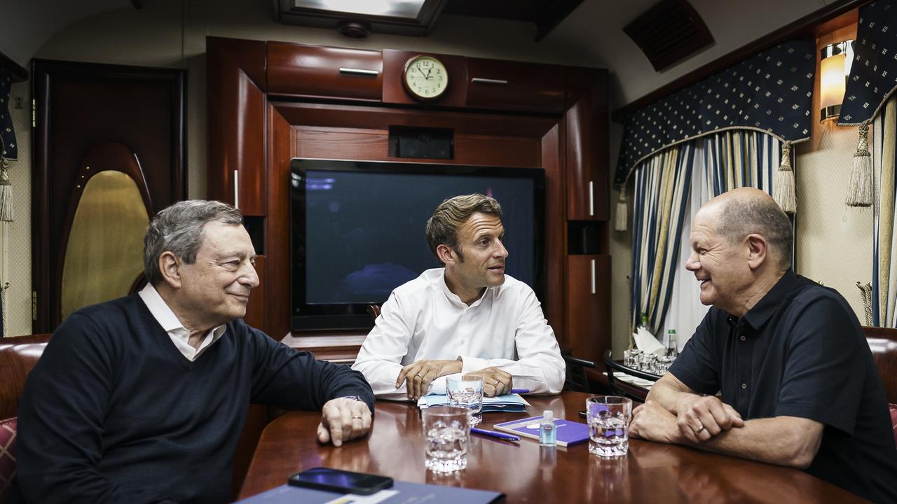 UNSPECIFIED, UKRAINE - JUNE 16: In this handout photo provided by the German Government Press Office (BPA), (L-R) Italy's Prime Minister Mario Draghi, France's President Emmanuel Macron and German Chancellor Olaf Scholz (SPD) sit on a night train traveling to Kyiv on June 16, 2022 in Ukraine. The leaders made their first visits to Ukraine since the country was invaded by Russia on February 24th. (Photo by Jesco Denzel/Getty Images via Bundesregierung)