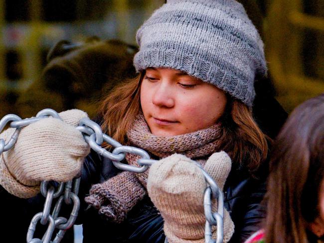 Swedish climate activist Greta Thunberg (2nd L) is seen among campaigners during an action staged on March 2, 2023 in Oslo, in a protest against wind turbines built on land traditionally used to herd reindeer. - Thunberg and dozens of indigenous Sami activists continued to block access to Norwegian ministries, protesting against the operation of contested wind turbines in the Fosen region of western Norway, more than a year after a landmark ruling by the Norwegian Supreme Court. (Photo by Javad Parsa / NTB / AFP) / Norway OUT