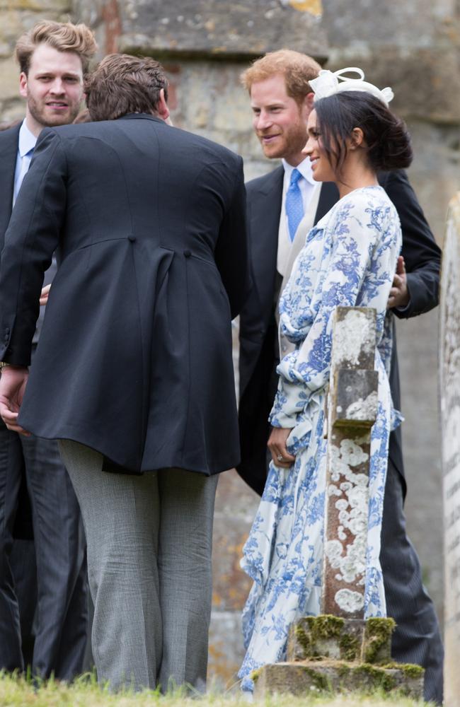 The new Duchess of Sussex wore a long-sleeved blue-and-white paisley shirt dress and white fascinator at the wedding of Princess Diana's niece, Celia McCorquodale — exactly four weeks after her big day.