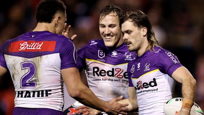 PENRITH, AUSTRALIA - AUGUST 15: Ryan Papenhuyzen of the Storm celebrates with team mates at full-time during the round 24 NRL match between Penrith Panthers and Melbourne Storm at BlueBet Stadium, on August 15, 2024, in Penrith, Australia. (Photo by Brendon Thorne/Getty Images)