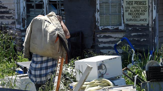 Ralph De Masi Navigates his way through the junk in his Malvern East front yard. Picture: Nicole Garmston