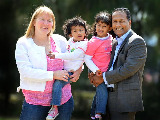 Moira Kelly and Atom Rahman with twins Krishna (left) and Trishna (right).