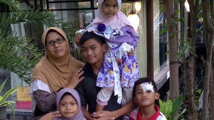 The family members responsible for the suicide bombings in Indonesia. Clockwise from left, Puji Kuswati with her four children, Yusuf Fadhil, Pamela Rizkita, Fiman Halim and Fadillah Sari.