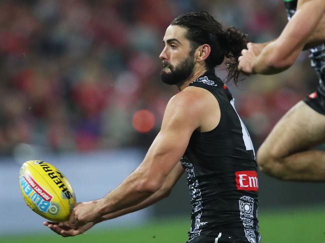 Collingwood's Brodie Grundy handballs during AFL Indigenous Round match between the Sydney Swans and Collingwood Magpies at the SCG on May 24, 2019. Picture. Phil Hillyard