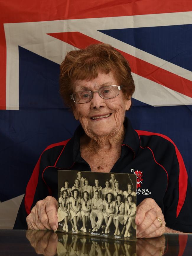 Cecilia Hynes -Former Fraser Coast Sportsperson of the Year. Holding a photo of the Ayr Anchors hockey team from 1939 - (she is front 2nd left).