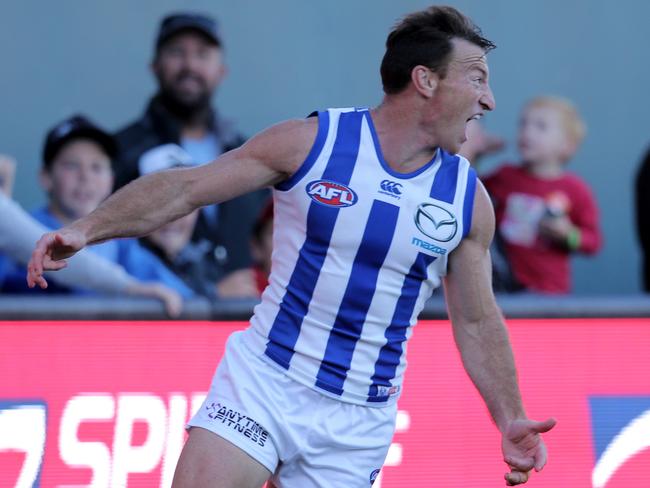 Brent Harvey celebrates a goal against the Demons. Picture: Luke Bowden