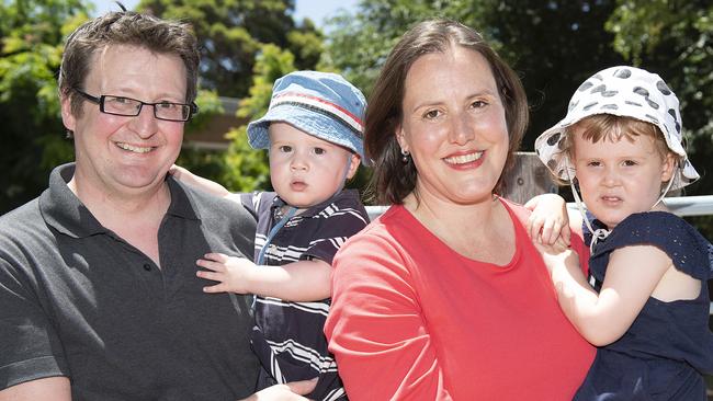 Jon Mant holding son Edward (left) and wife Kelly O'Dwyer holding daughter Olivia after she announced she’s quitting politics. Picture: Ellen Smith/AAP