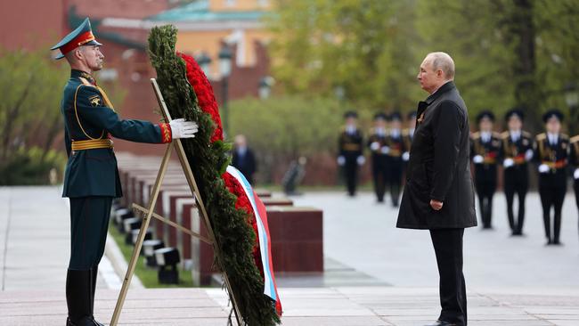 Russian President Vladimir Putin attends a wreath-laying ceremony at the Tomb of the Unknown Soldier after the Victory Day military parade in central Moscow. Picture: Anton Novoderezhkin / Sputnik / AFP