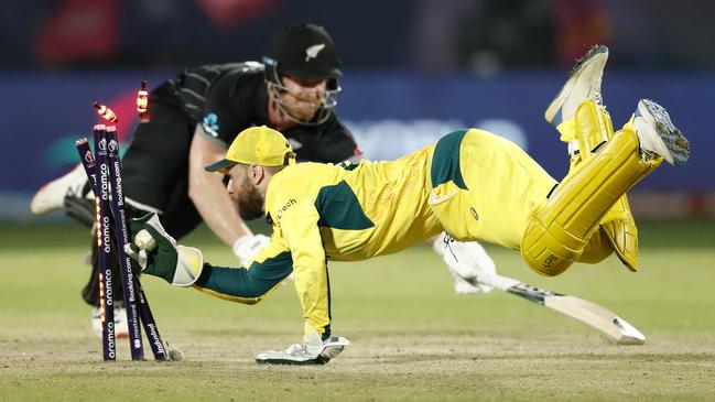 New Zealand’s Jimmy Neesham is run out by wicketkeeper Josh Inglis during the ICC Men's Cricket World Cup India 2023. Picture: Darrian Traynor/ICC via Getty Images