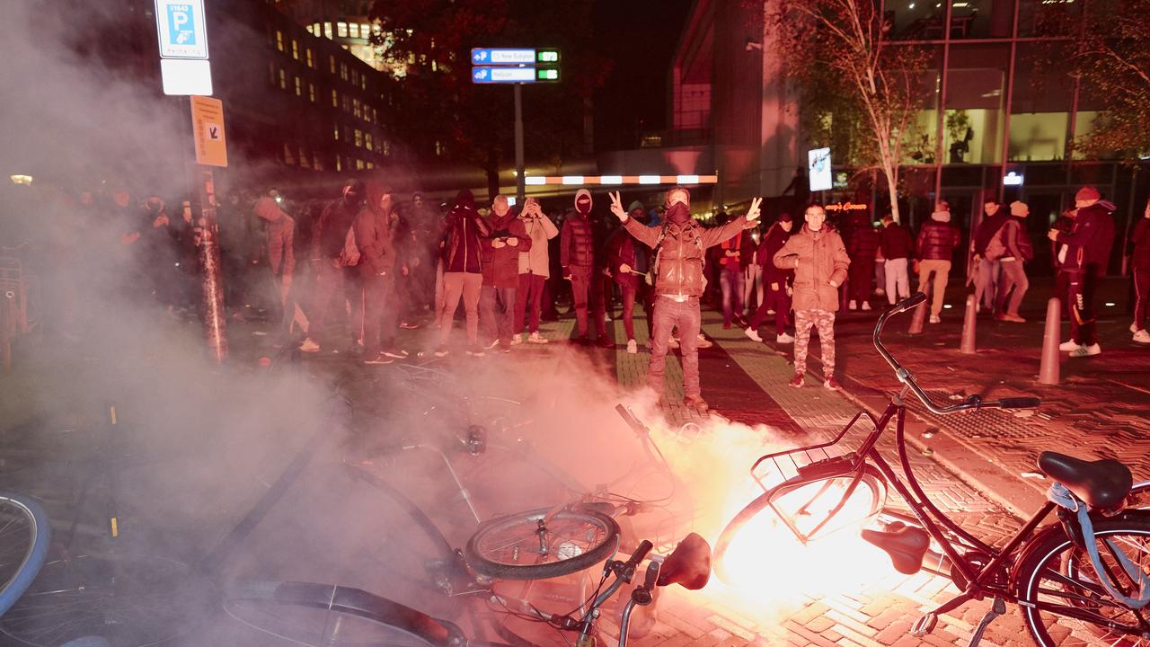 A flare burns on a barricade of bicycles built by anti-vaxxers and anti-lockdown protesters on November 12, 2021 in The Hague, Netherlands. Picture: Pierre Crom/Getty Images