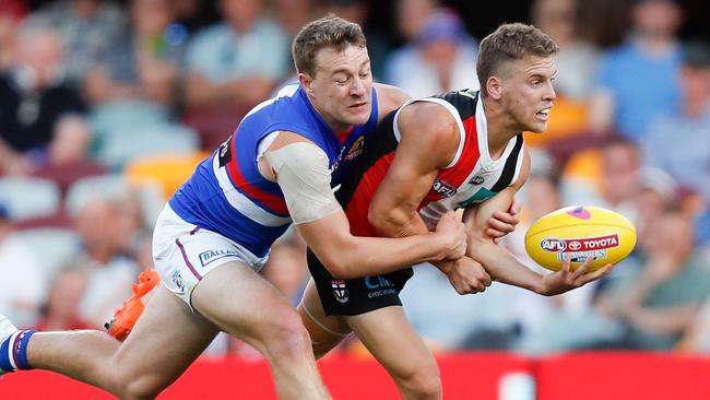 Jack Macrae continued to play after his collision with Ben Long. Picture: Michael Willson/AFL Photos via Getty Images