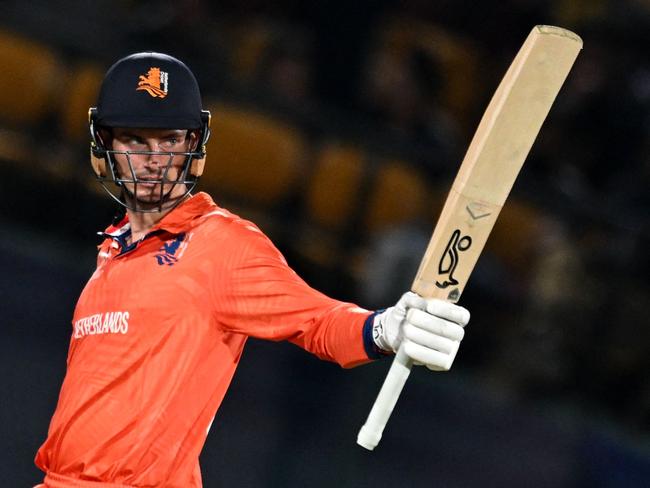 Netherlands' captain Scott Edwards celebrates after scoring a half-century (50 runs) during the 2023 ICC Men's Cricket World Cup one-day international (ODI) match between South Africa and Netherlands at the Himachal Pradesh Cricket Association Stadium in Dharamsala on October 17, 2023. (Photo by Money SHARMA / AFP) / -- IMAGE RESTRICTED TO EDITORIAL USE - STRICTLY NO COMMERCIAL USE --