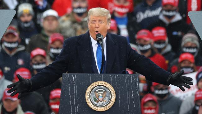 US President Donald Trump addresses thousands of supporters during a campaign rally in Lansing, Michigan. Picture: Getty Images