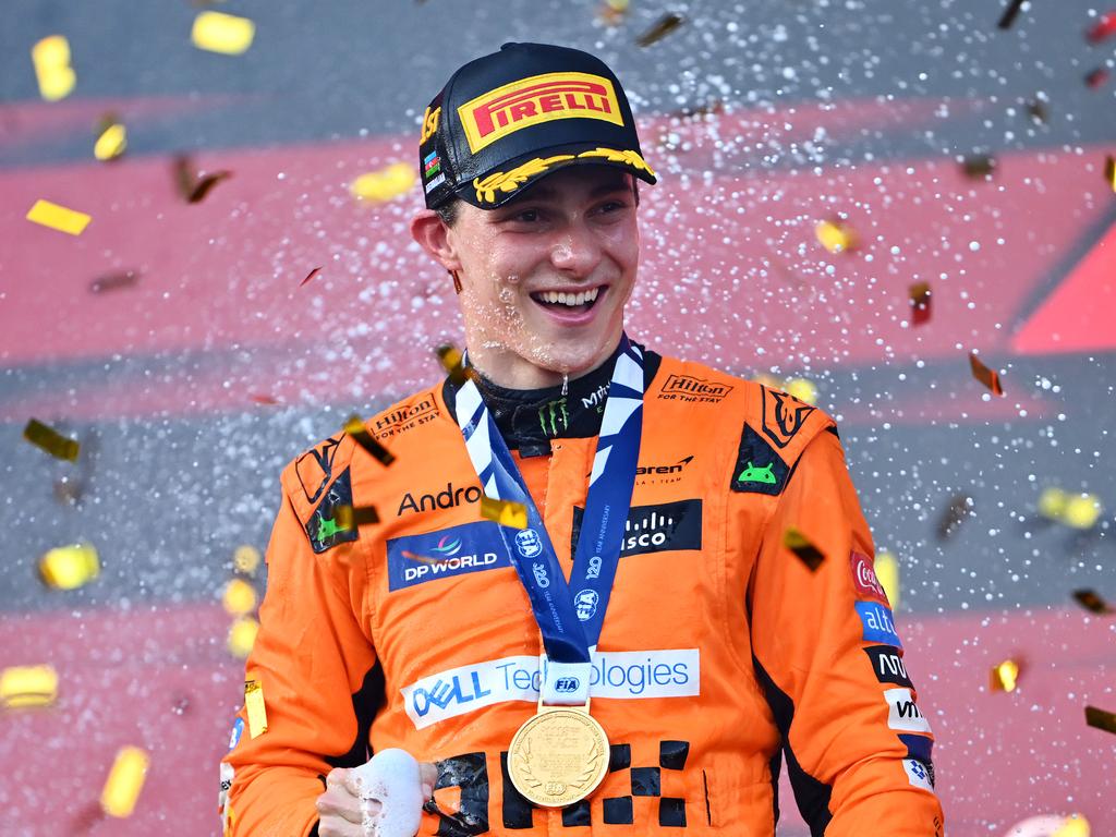 BAKU, AZERBAIJAN - SEPTEMBER 15: Race winner Oscar Piastri of Australia and McLaren celebrates on the podium during the F1 Grand Prix of Azerbaijan at Baku City Circuit on September 15, 2024 in Baku, Azerbaijan. (Photo by Dan Mullan/Getty Images)