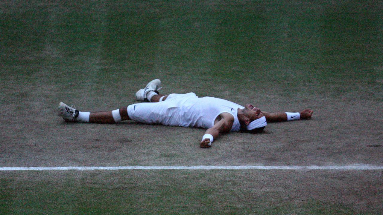 Rafael Nadal celebrating after beating Roger Federer in the 2008 epic Wimbledon fire.
