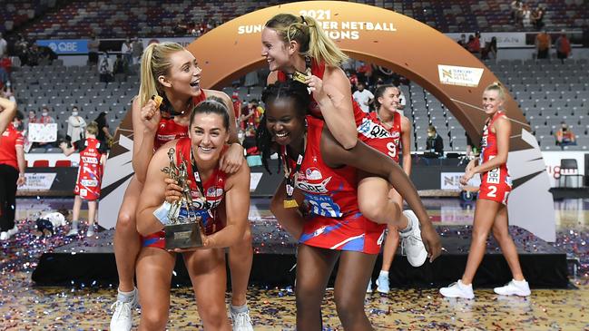 NSW Swifts players Helen Housby, Sophie Garbin, Nat Haythornthwaite and Sam Wallace celebrate their Grand Final victory last season.