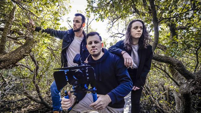 Producer and filmmaker Dion Cavallaro with actors Sean Filerl and Katerina Mastoris in the St Kilda mangroves. Picture: Roy VanDerVegt/AAP