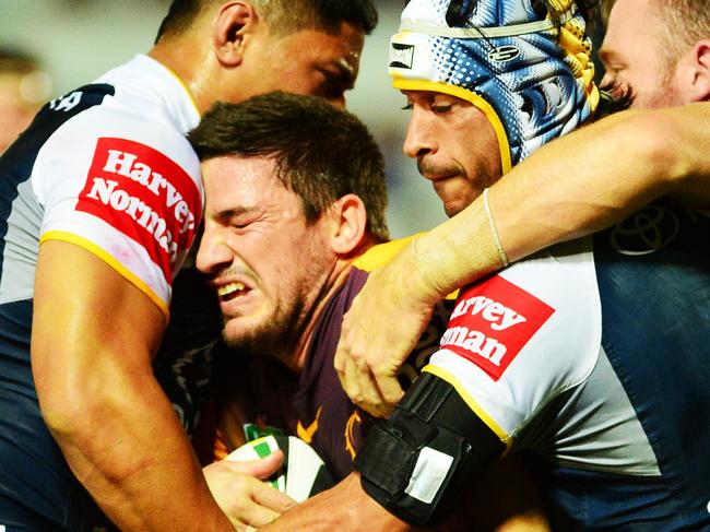 The North Queensland Cowboys v the Brisbane Broncos from 1300 Smiles Stadium. Broncos Matt Gillett is tackled by Cowboys Jason Taumalolo, Jonathan Thurston and Gavin Cooper. Picture: Zak Simmonds.