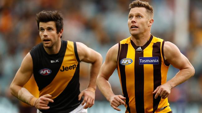 Trent Cotchin and Sam Mitchell were foes on the field, but united in accepting the 2012 Brownlow Medal. Picture: AFL Media