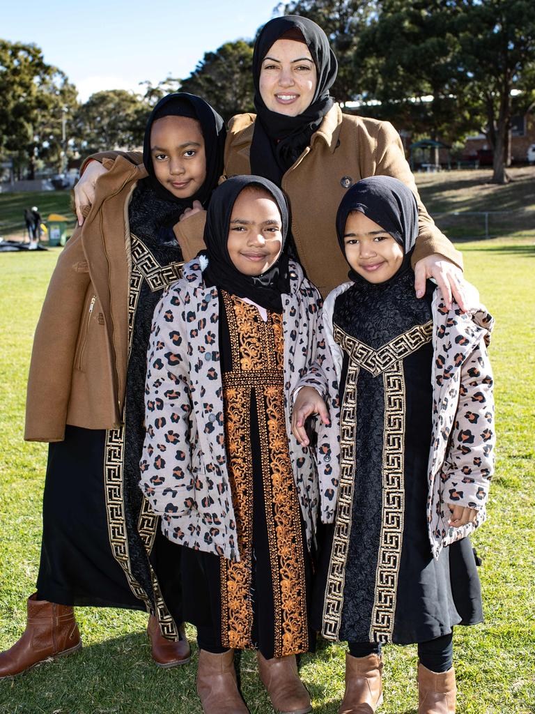 Fadwa Oyekan, of Greenacre, with Ameera, 9, Khadeeja, 7, and Humayra, 5, at Roberts Park, Greenacre. Picture: Julian Andrews. Photos can be purchased at newsphotos.com.au