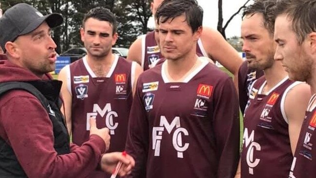 Melton coach Aaron Tymms addresses his players.