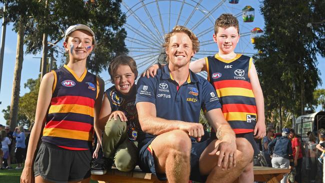 Crows star Rory Sloane with fans Tom O'Dea, 7, Riley Shaw, 7, and Ellen Sampson, 12, at the Crows Fan Fair at Wayville Showgrounds. Picture: Tom Huntley