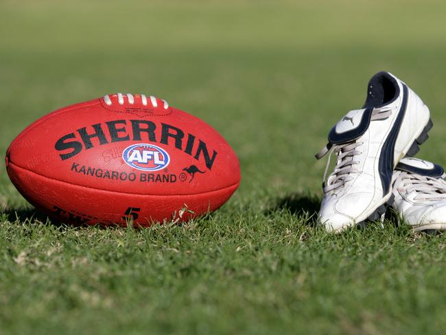 Generic AFL Sherrin football and football boots. sport /