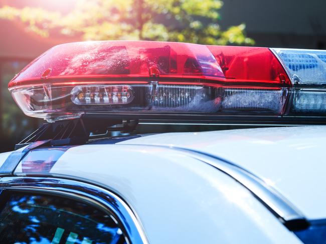 Police force department in full activity. Red light flasher of a patrol police car at sunday. Day patrolling of the city with lights flashers turned off. Security siren of the Canadian police vehicle.