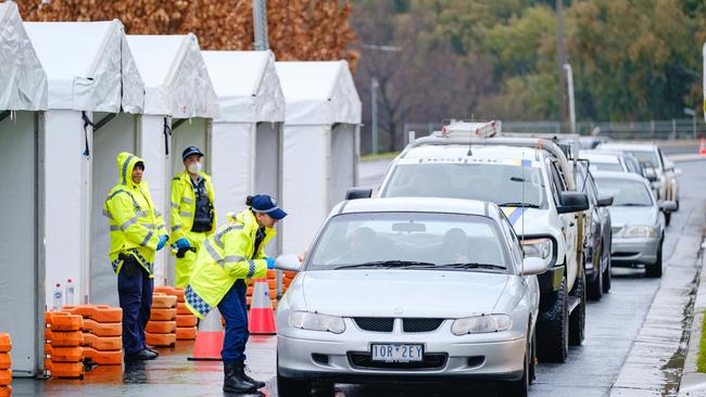 Anyone crossing between Victoria and NSW needs to reapply for a permit as the rules have changes. Pictured here is a road block set up in Wodonga Place, Albury at the NSW border. Picture: Simon Dallinger