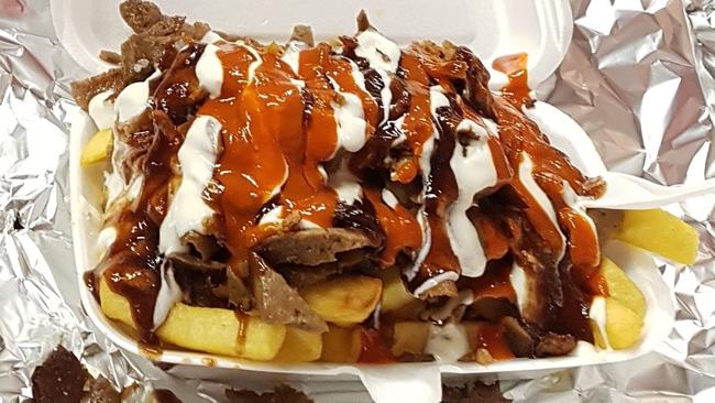 Queens' Kebabs serve up massive HSPs at its King St Melbourne store. Picture: Kiel Egging.