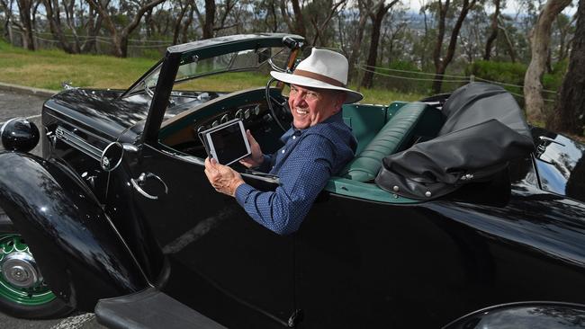 Jim Davies and his 1939 Morris checks out Advertiser.com.au’s interactive guide ahead of this year's Bay to Birdwood. Picture: Tom Huntley