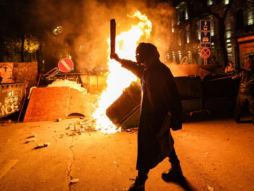 Angry protesters lit fires in the streets. Picture: Giorgi ARJEVANIDZE / AFP