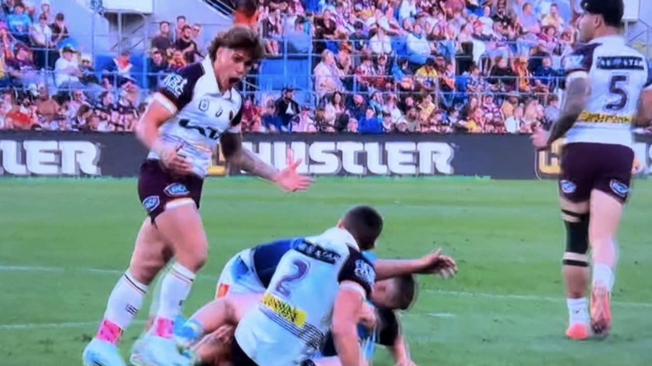 Reece Walsh blows up at Corey Oates for dropping his pass. Pic: Fox League