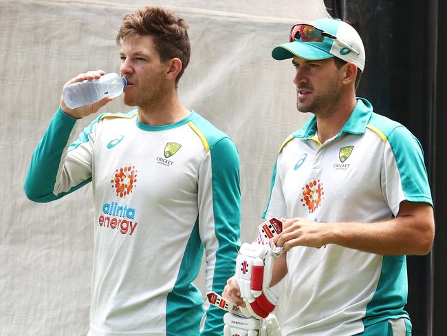 Tim Paine (left) and Joe Burns take a break during an Australian nets session. Picture: Ryan Pierse / Getty Images