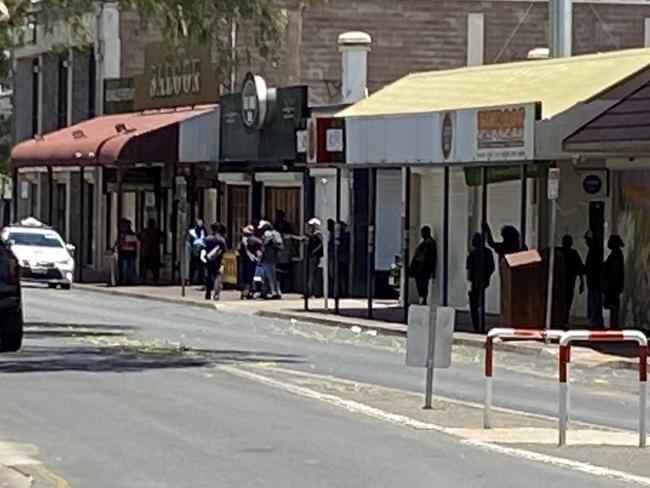 The queue outside an Alice Springs pub waiting for it to open. Picture: Matt Cunningham