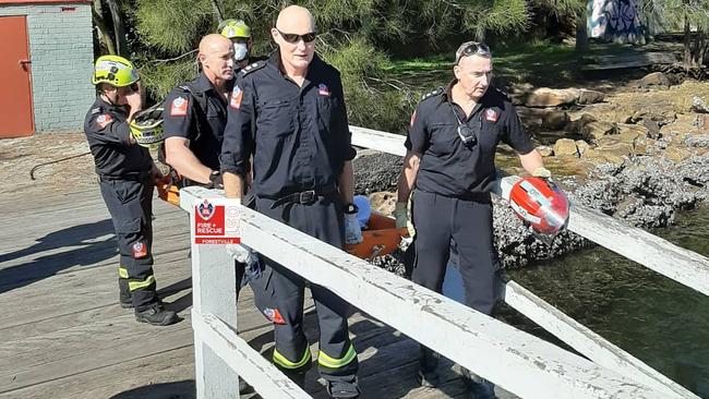 The stretcher being taken on to the wharf at Bantry Bay. Picture: NSW Fire and Rescue (Forestville)