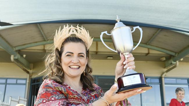 Part owner of Galway, Jackie Galwin, with the cup for the first race on Coffs Cup Day.